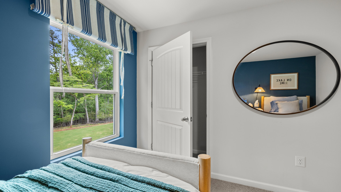 Interior bedroom with window and closet