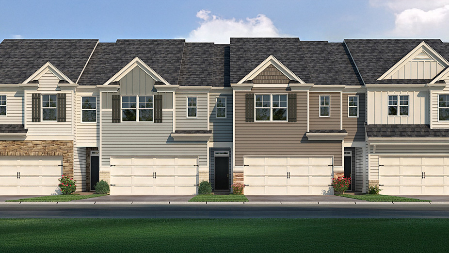 Exterior townhomes with cladding and stone detailing