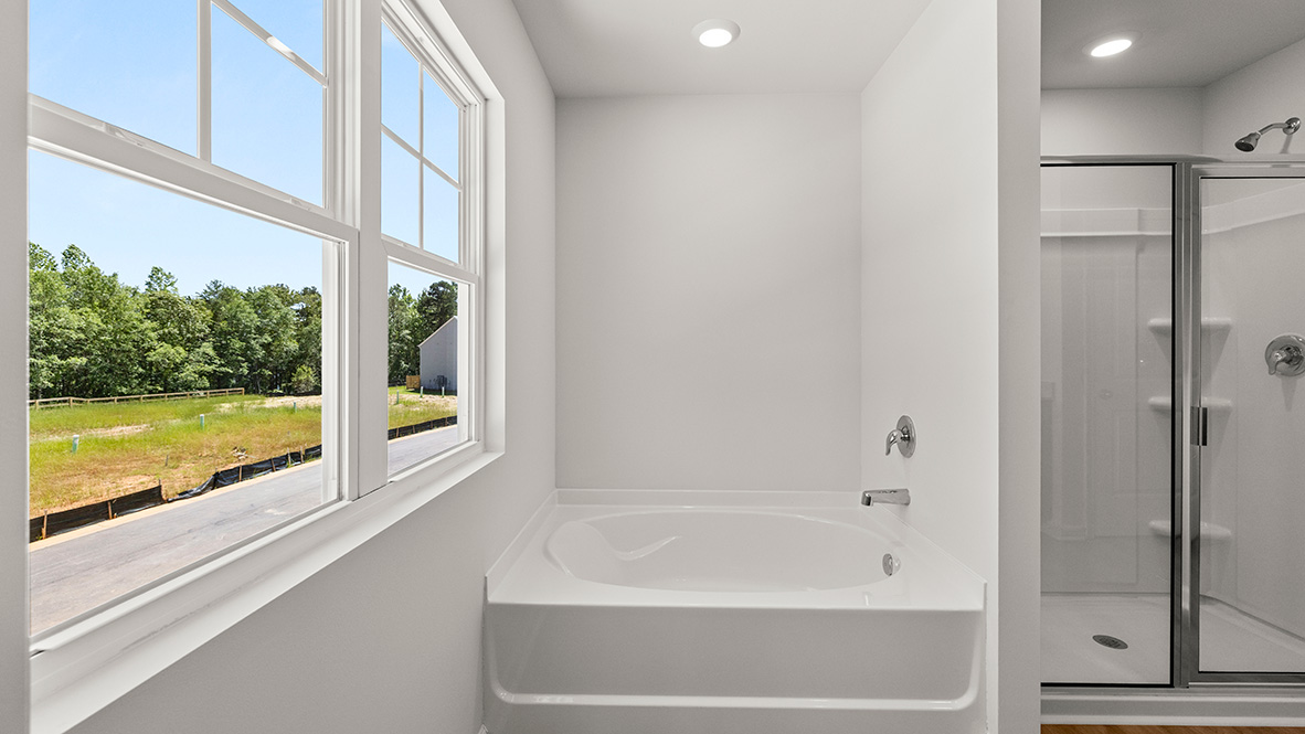 Interior bathroom with bath tub and shower