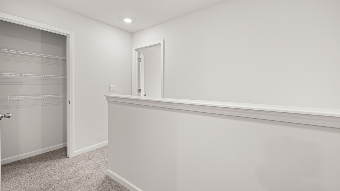 Interior upstairs loft area open to staircase