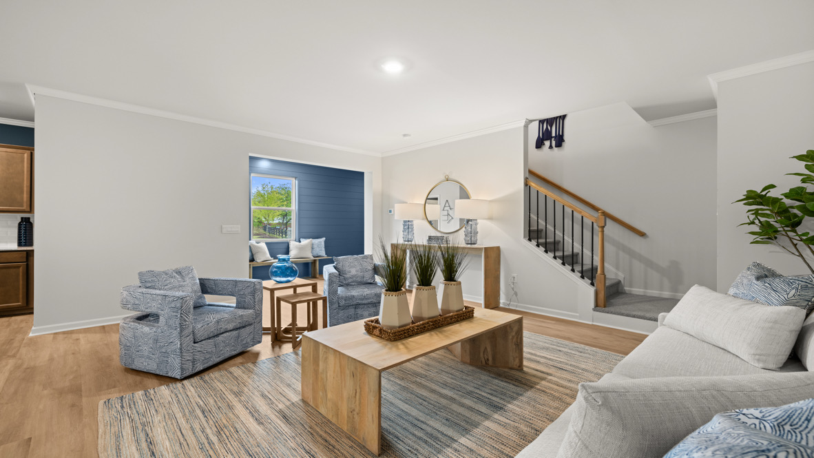 Living room with a view of the stairway.