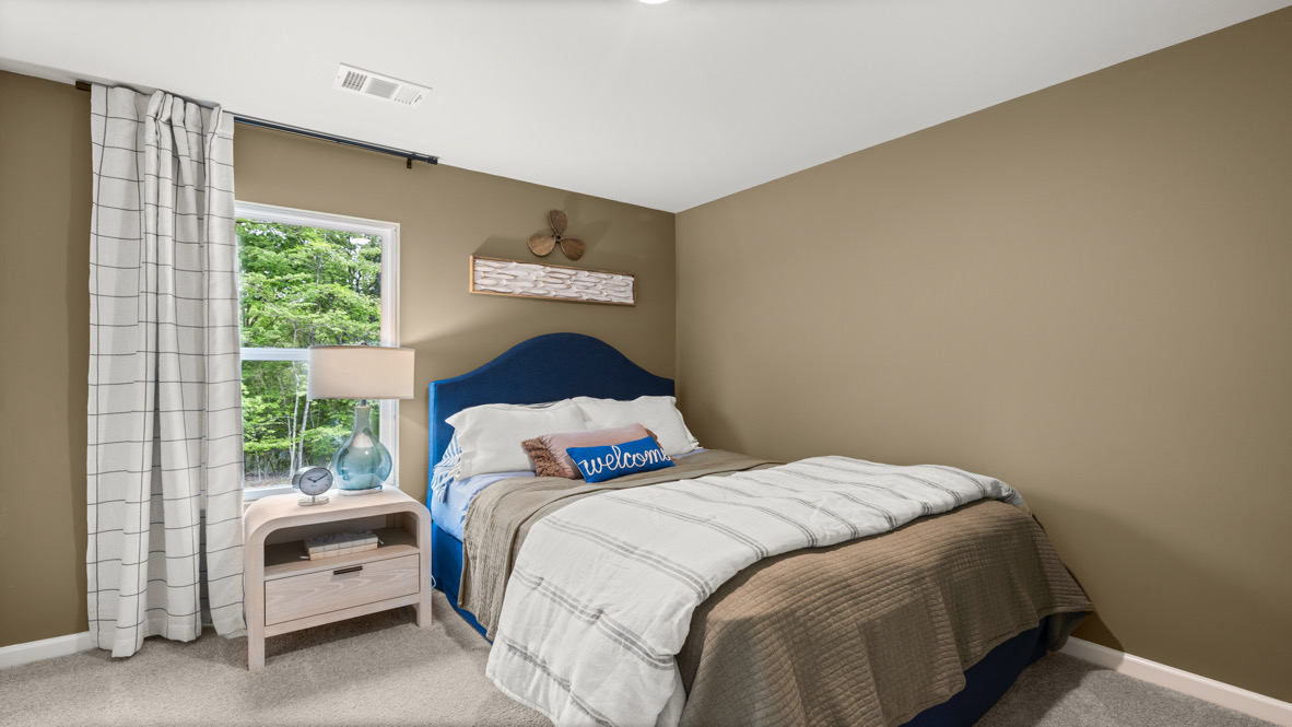 Bedroom with neutral carpet