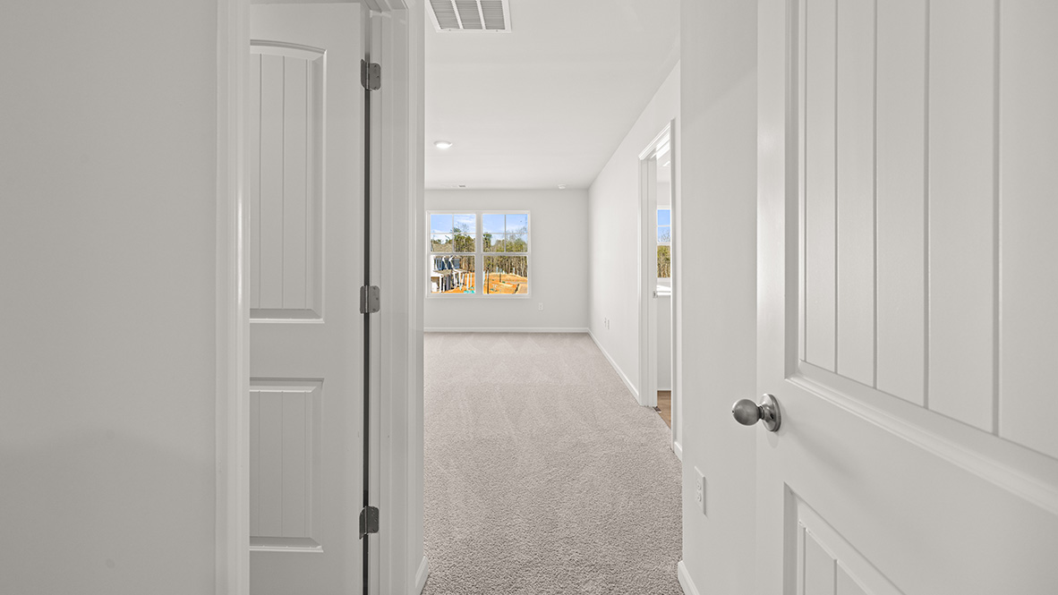Interior primary bedroom with large window
