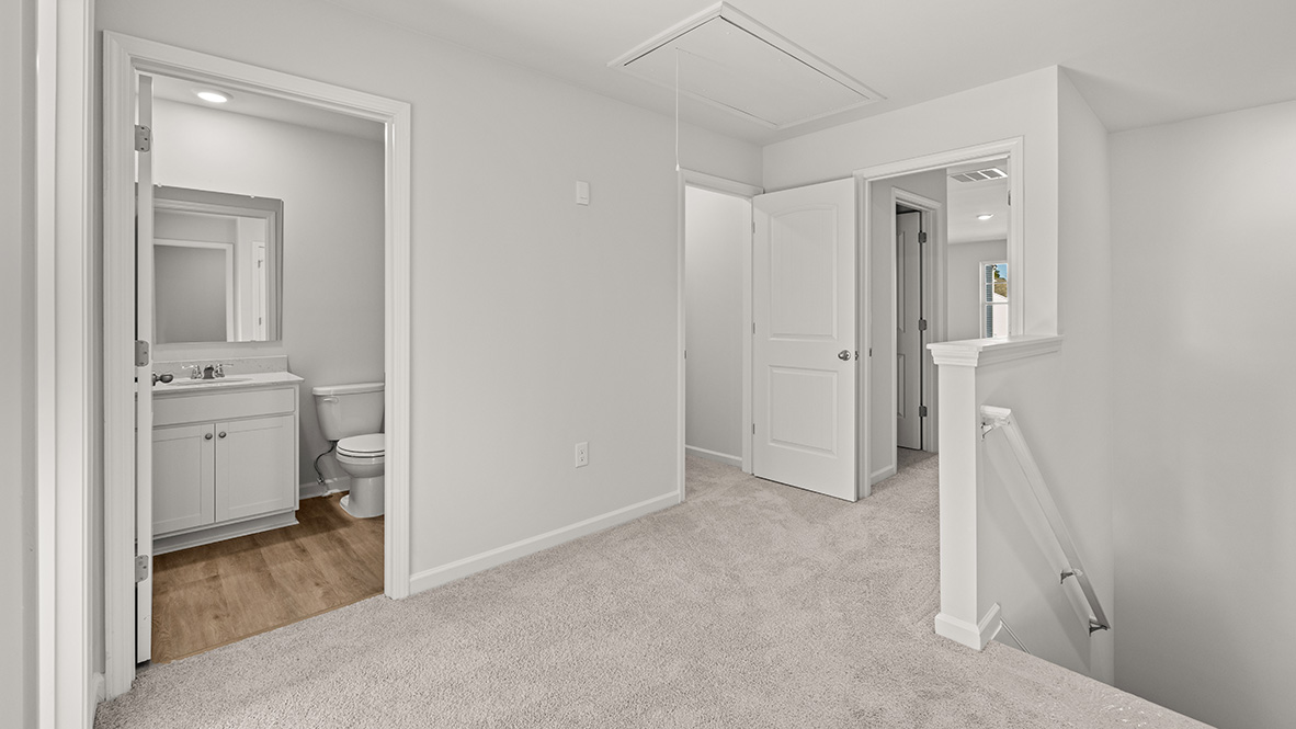 Interior upstairs loft area open to staircase