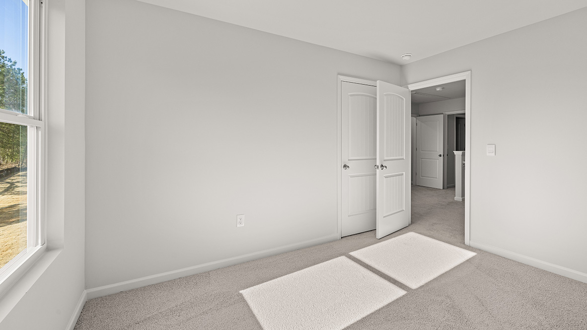 Interior bedroom with closet and window