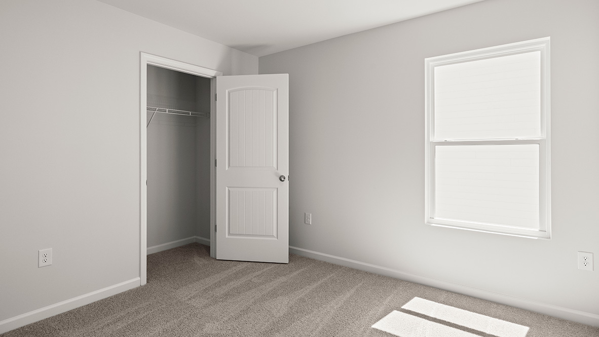 Interior bedroom with closet and window