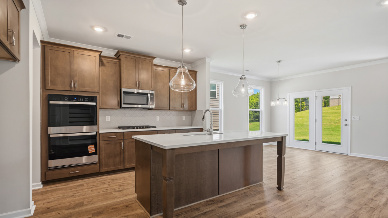 angled kitchen with spacious burlap cabinetry and large center island