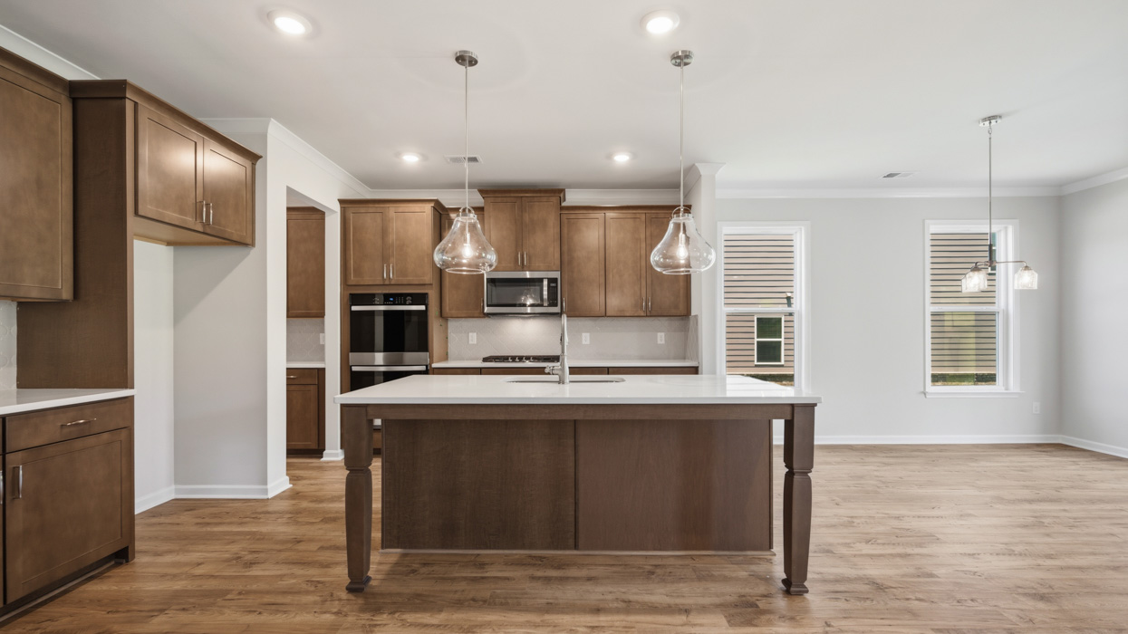 kitchen with spacious burlap cabinetry and large center island
