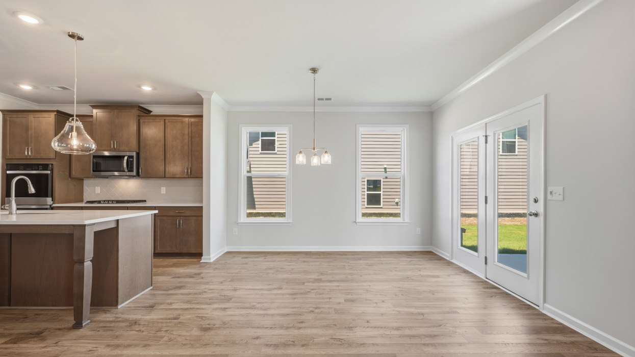 breakfast room with abundance of natural light and rear patio access
