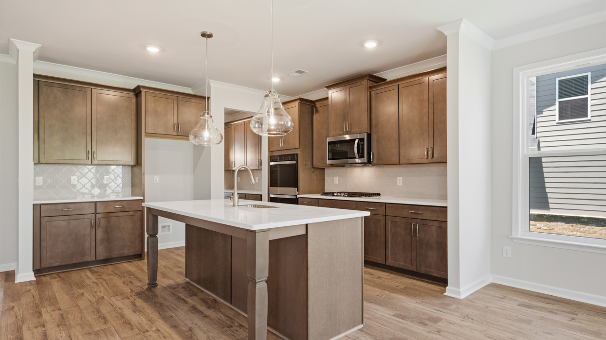angled kitchen with spacious burlap cabinetry and large center island