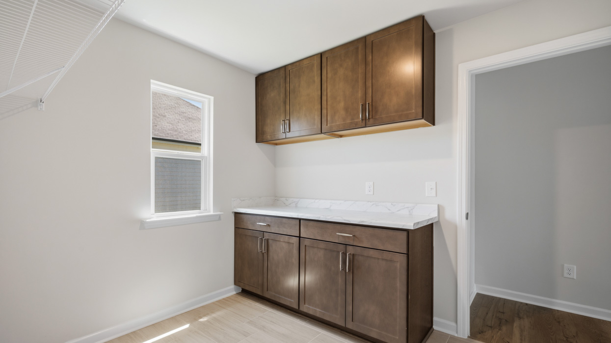 laundry room with burlap cabinetry