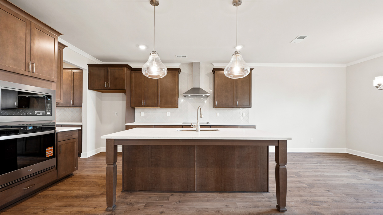 kitchen with spacious burlap cabinetry with large center island