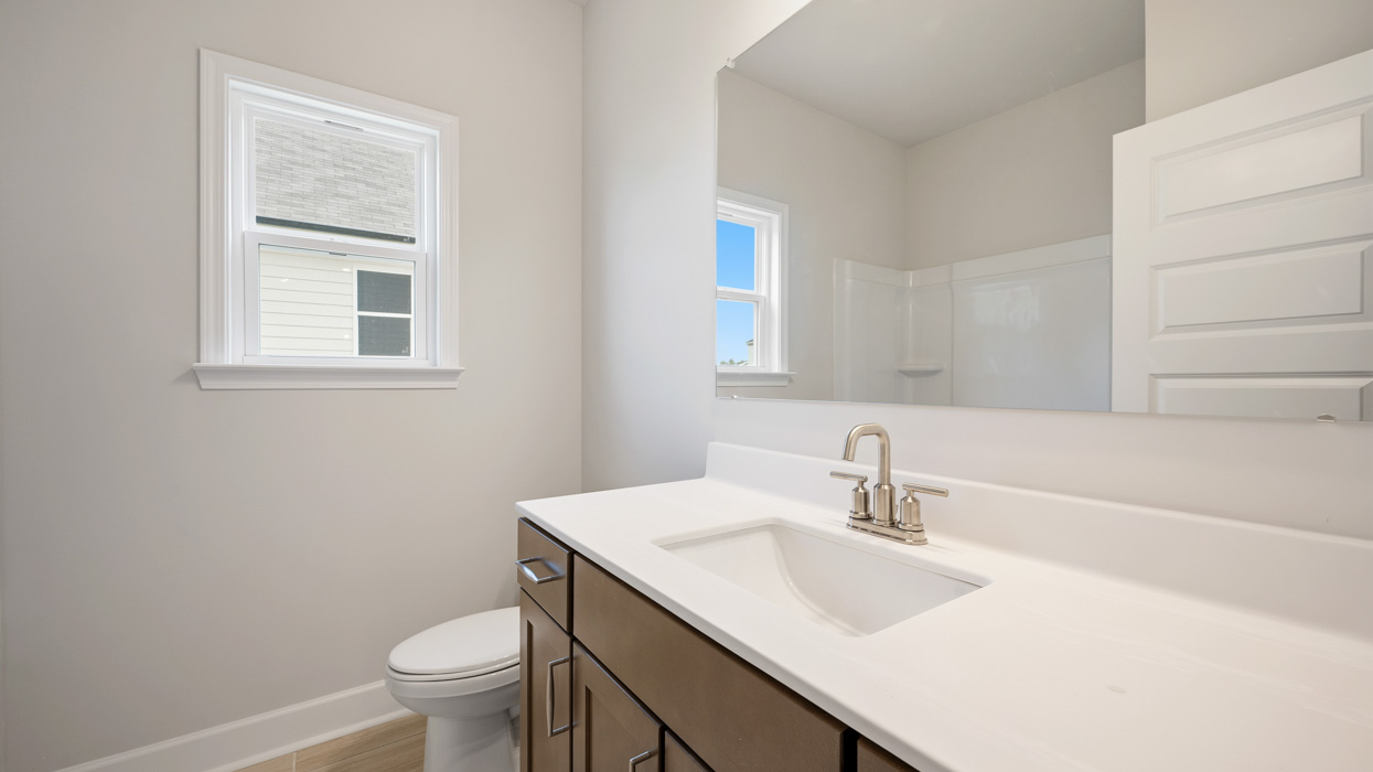 bathroom with single sink and natural light