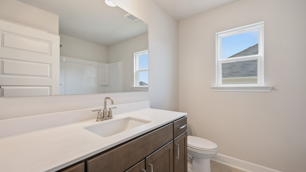 bathroom with single sink and natural light
