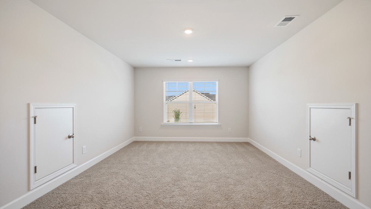 upstairs loft with natural light and attic access