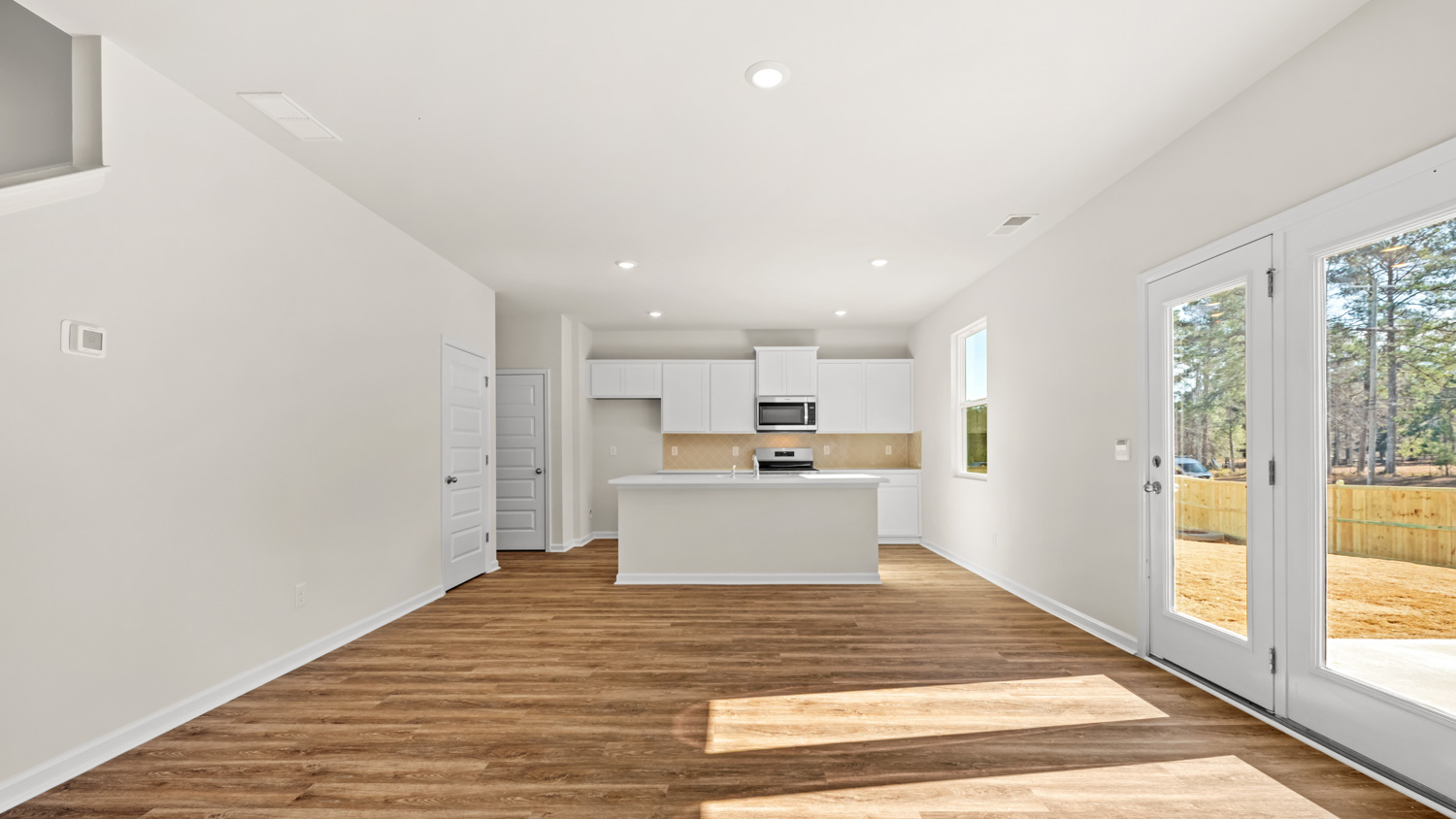 kitchen from living room with access to patio
