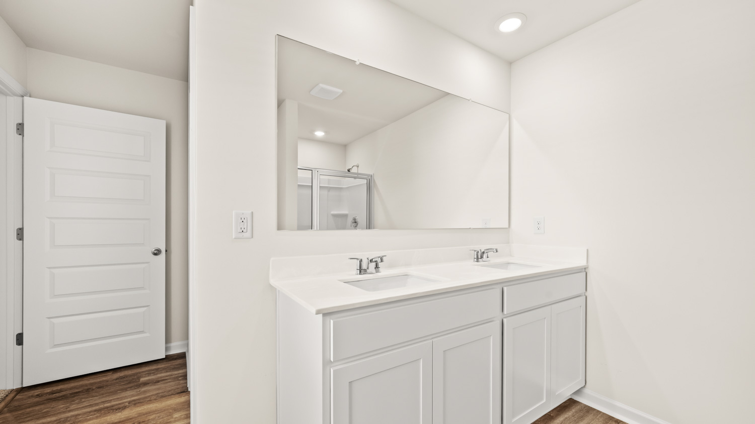 primary bathroom with dual sinks