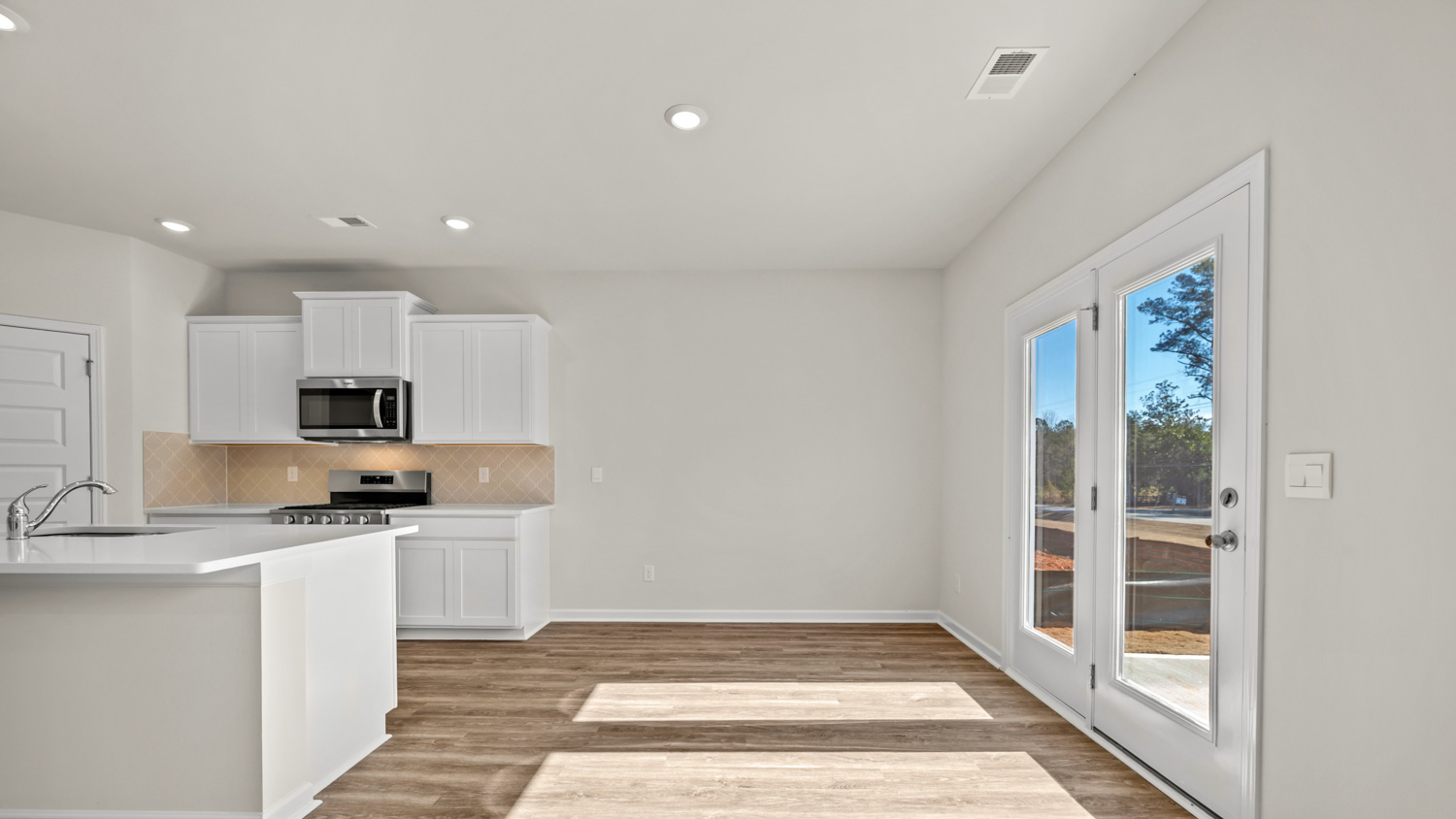 dining room from living room with access to patio