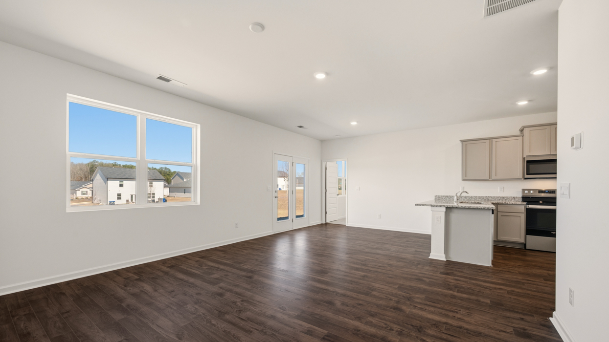 living room with natural light and access to patio