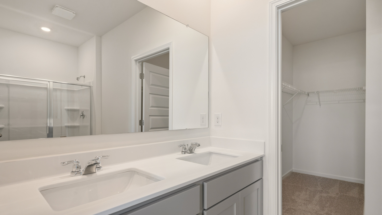 primary bathroom with dual sinks