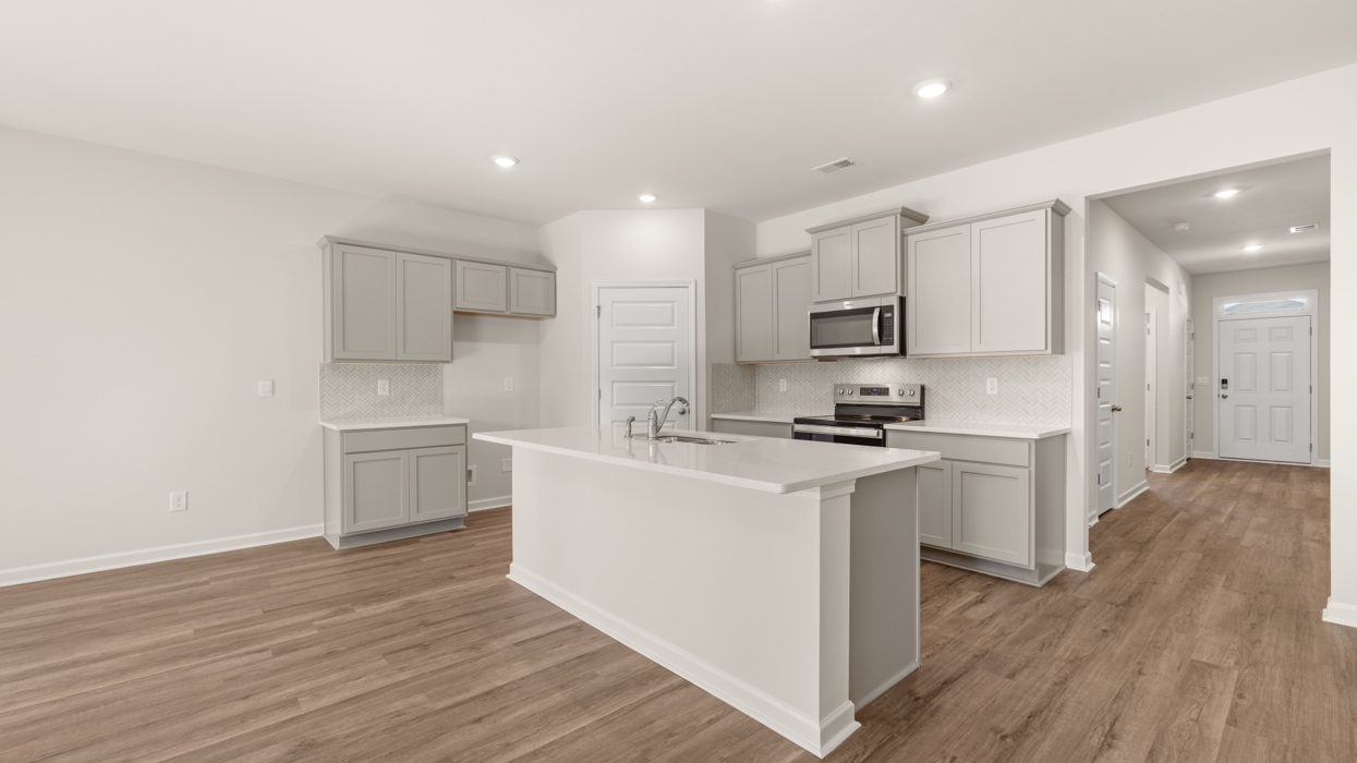 angled kitchen with spacious gray cabinets
