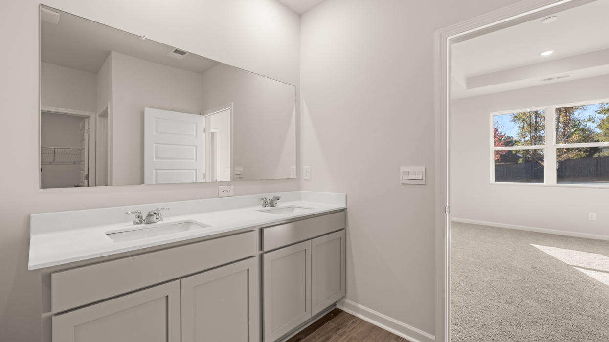 primary bathroom with dual sinks