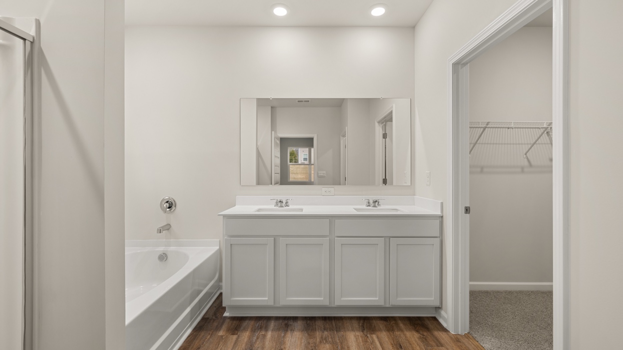 primary bathroom with dual sinks