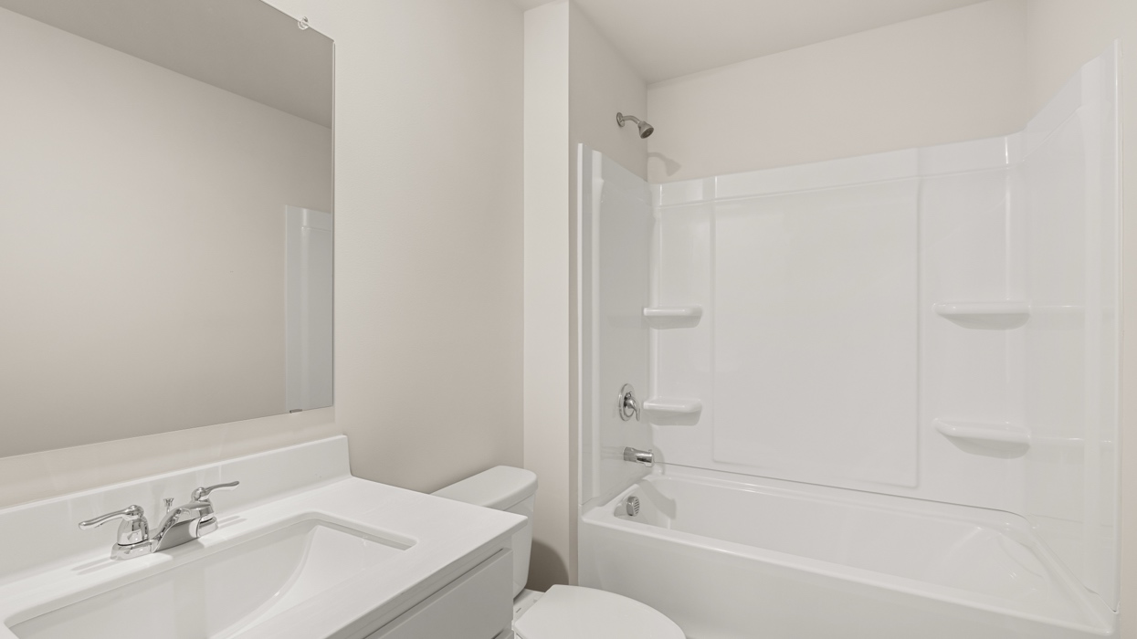 bathroom with single sink and bathtub