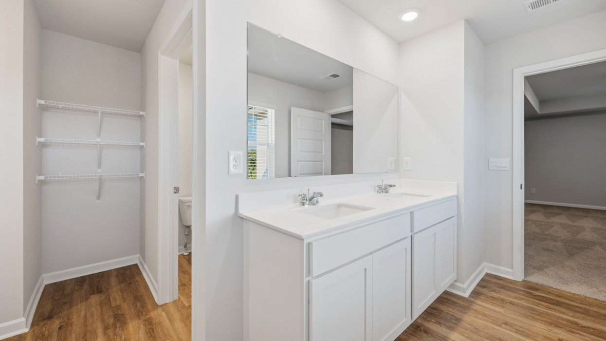 primary bathroom with dual sinks