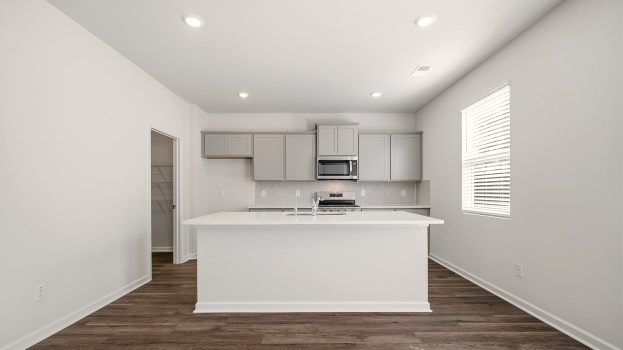kitchen with spacious gray cabinets and large center island