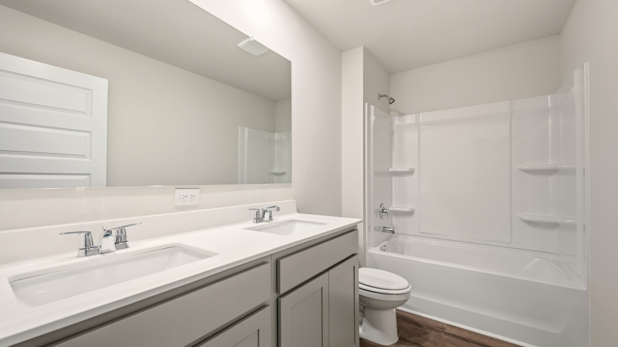 bathroom with dual sinks