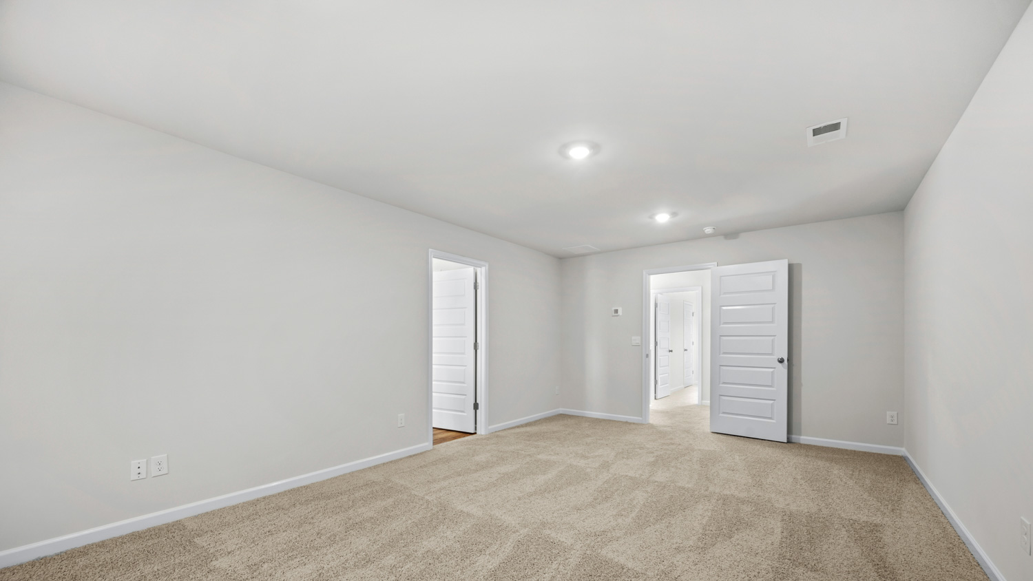 primary bedroom with puck lights