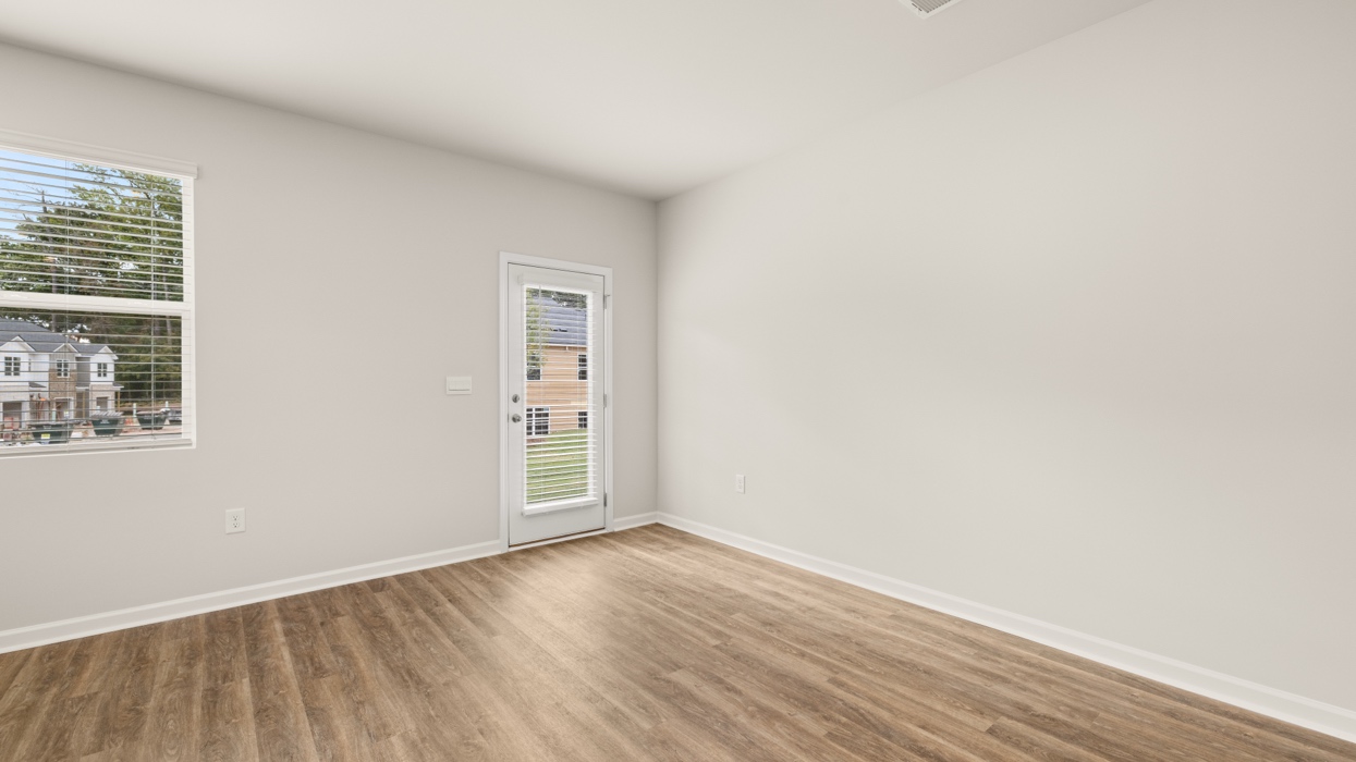 angled breakfast room with rear patio access