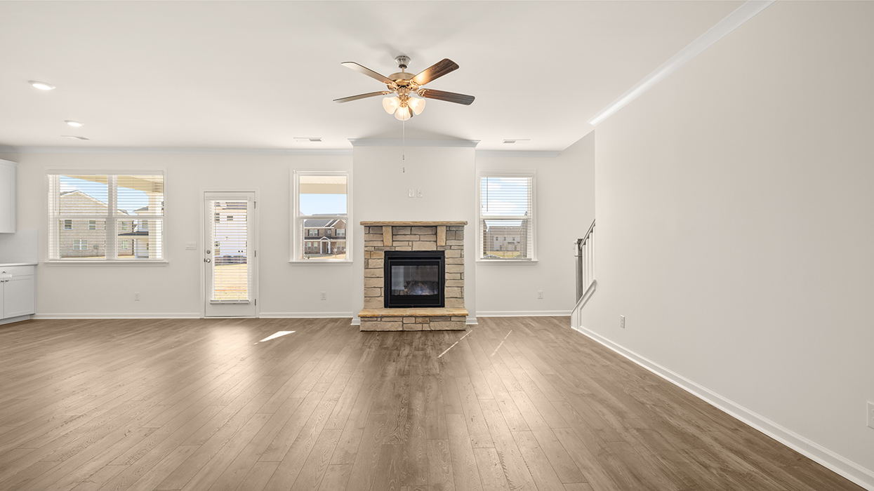 living room with natural light and ceiling fan