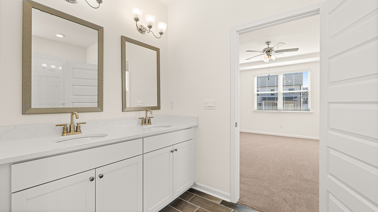 primary bathroom with dual sinks