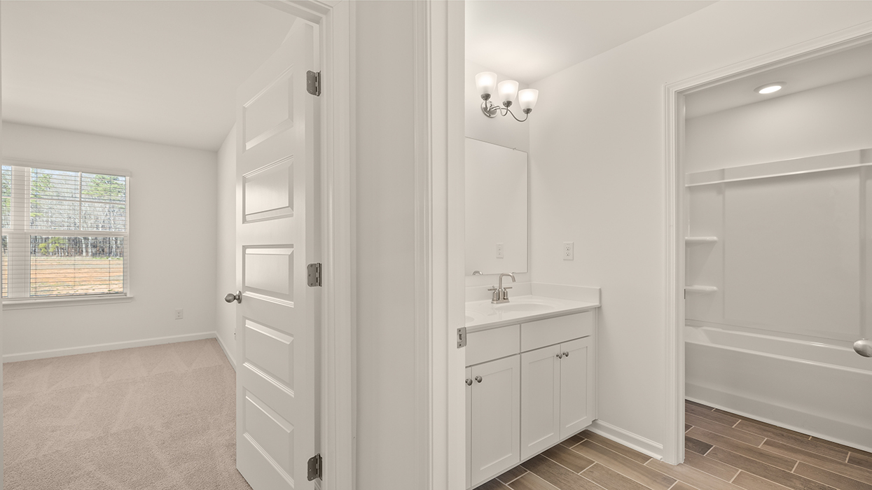 bathroom with single sink and water closet