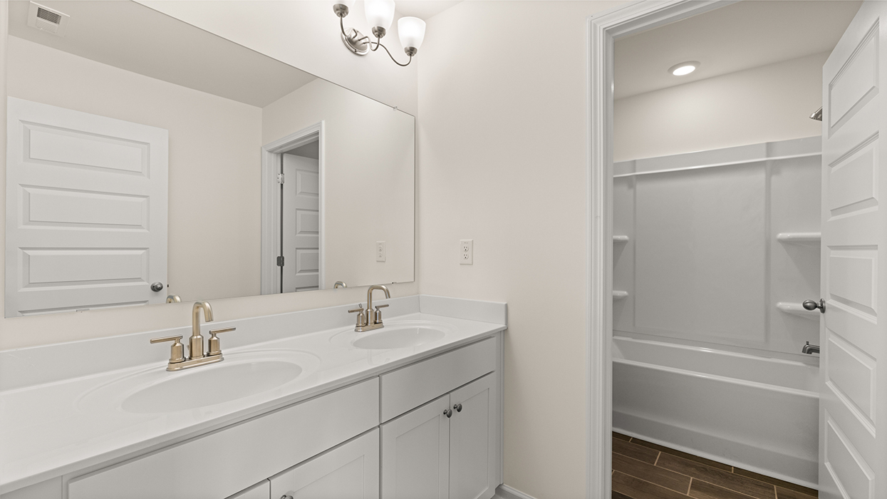 bathroom with dual sinks