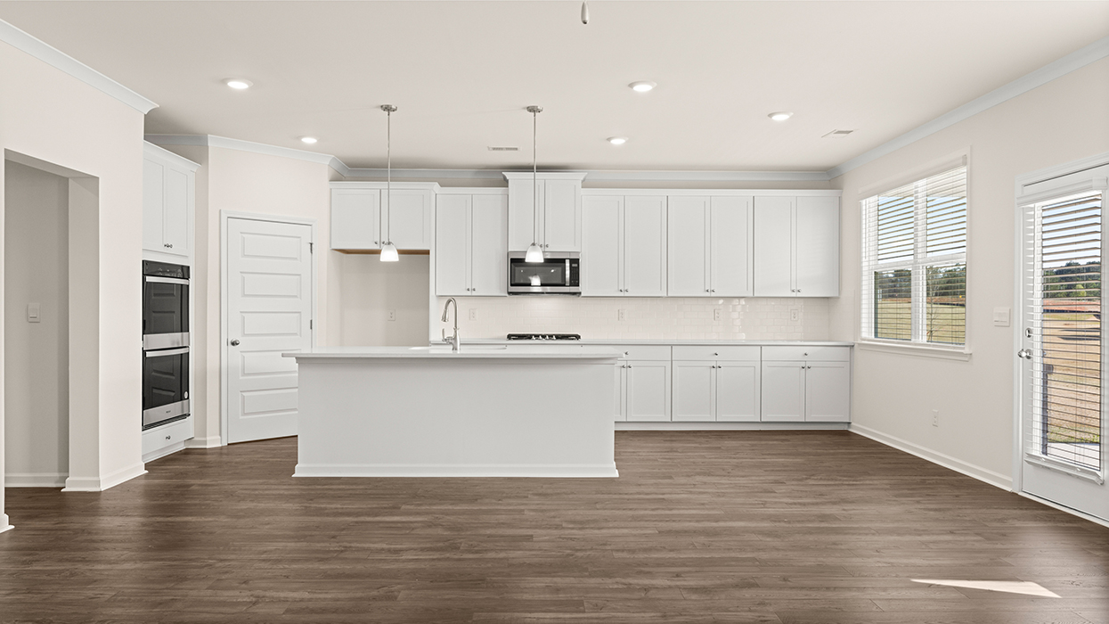 kitchen with spacious white cabinetry and large center island