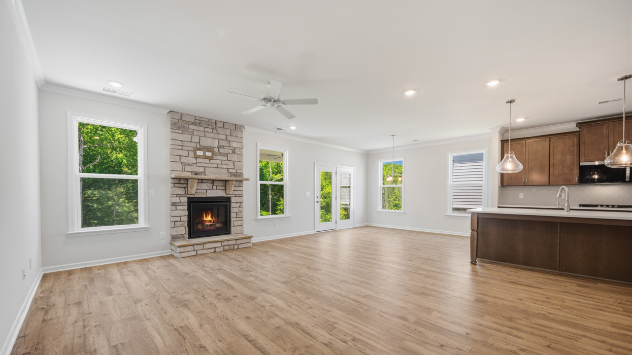 family room and fireplace to kitchen