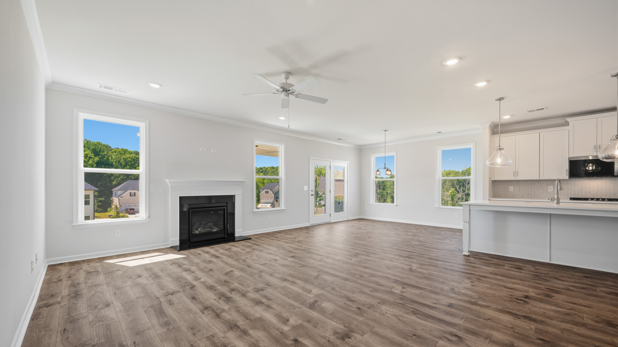 family room with fireplace to kitchen