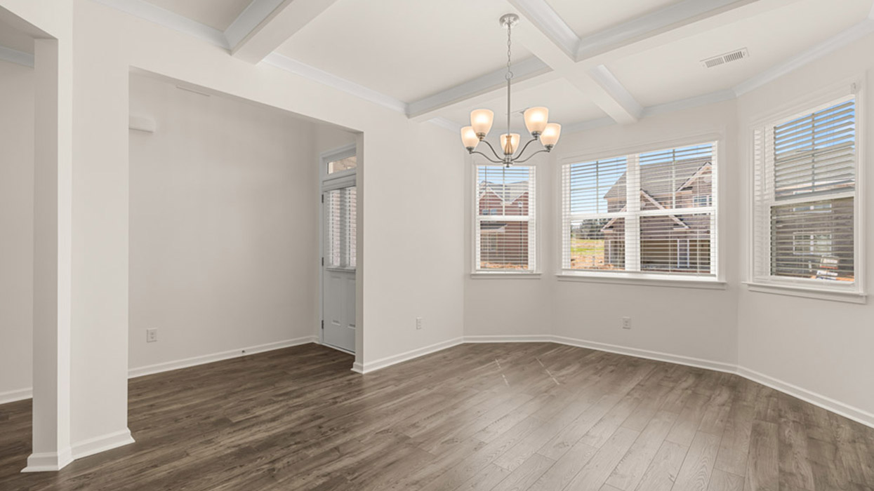 angled dining room with ceiling fan