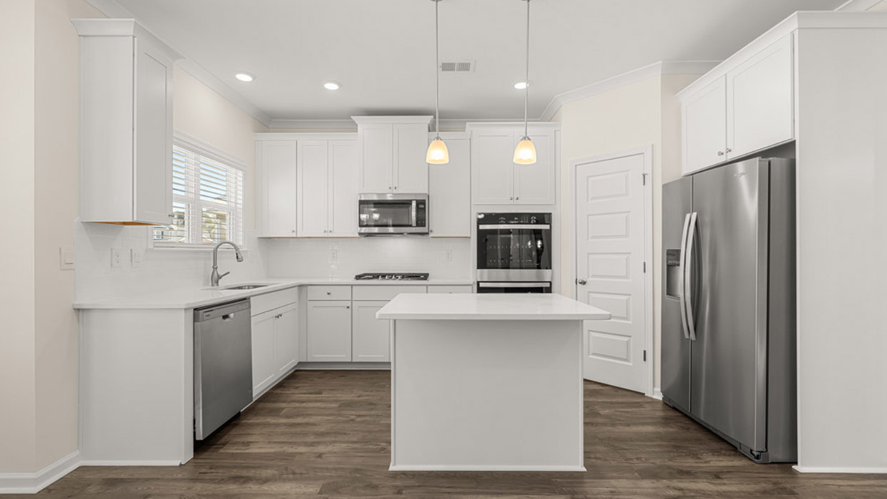 kitchen with spacious white cabinets and center island