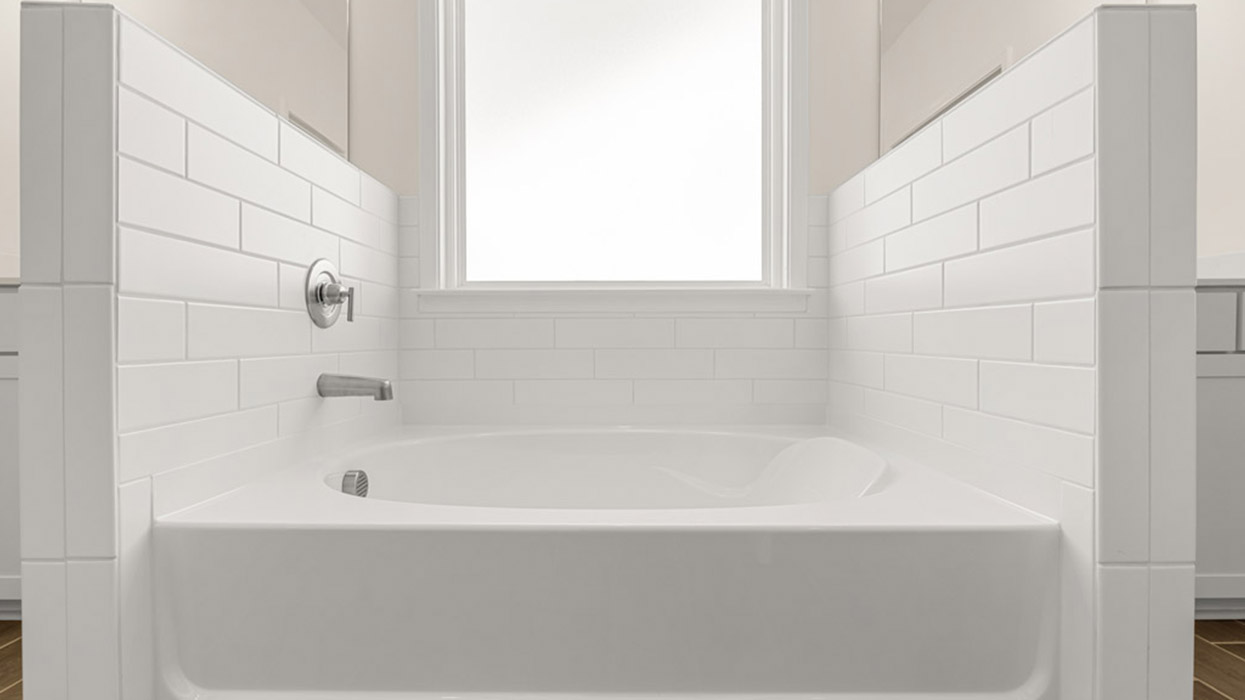 primary bathroom with quartz bath tub