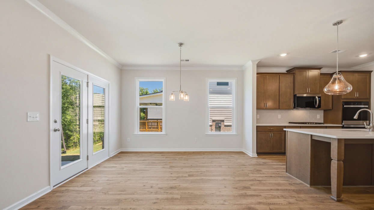 casual dining room with natural light and access to patio