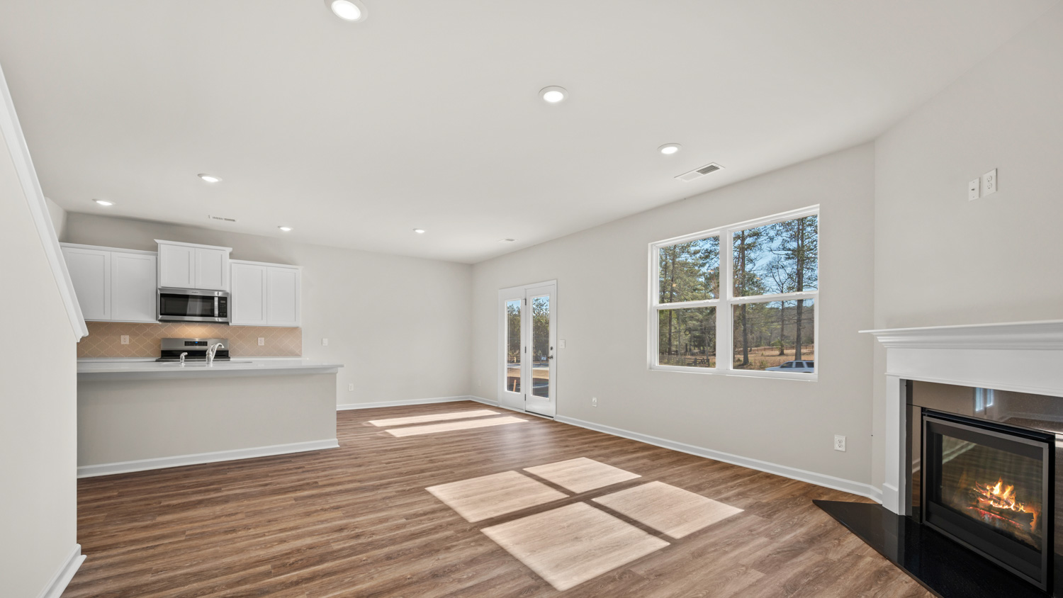 living room with access to back patio and natural light