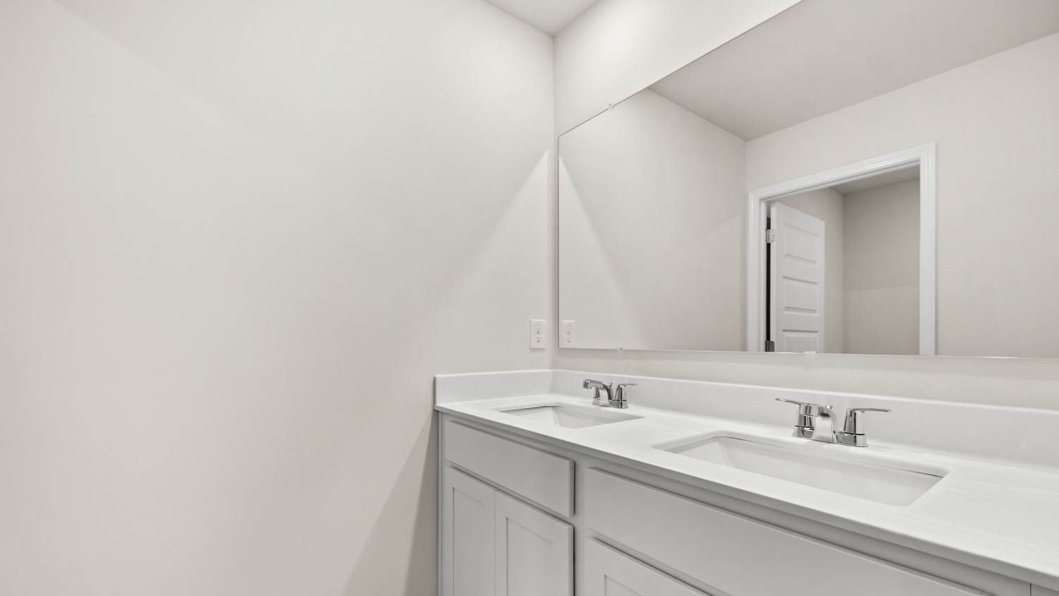 bathroom with dual sinks