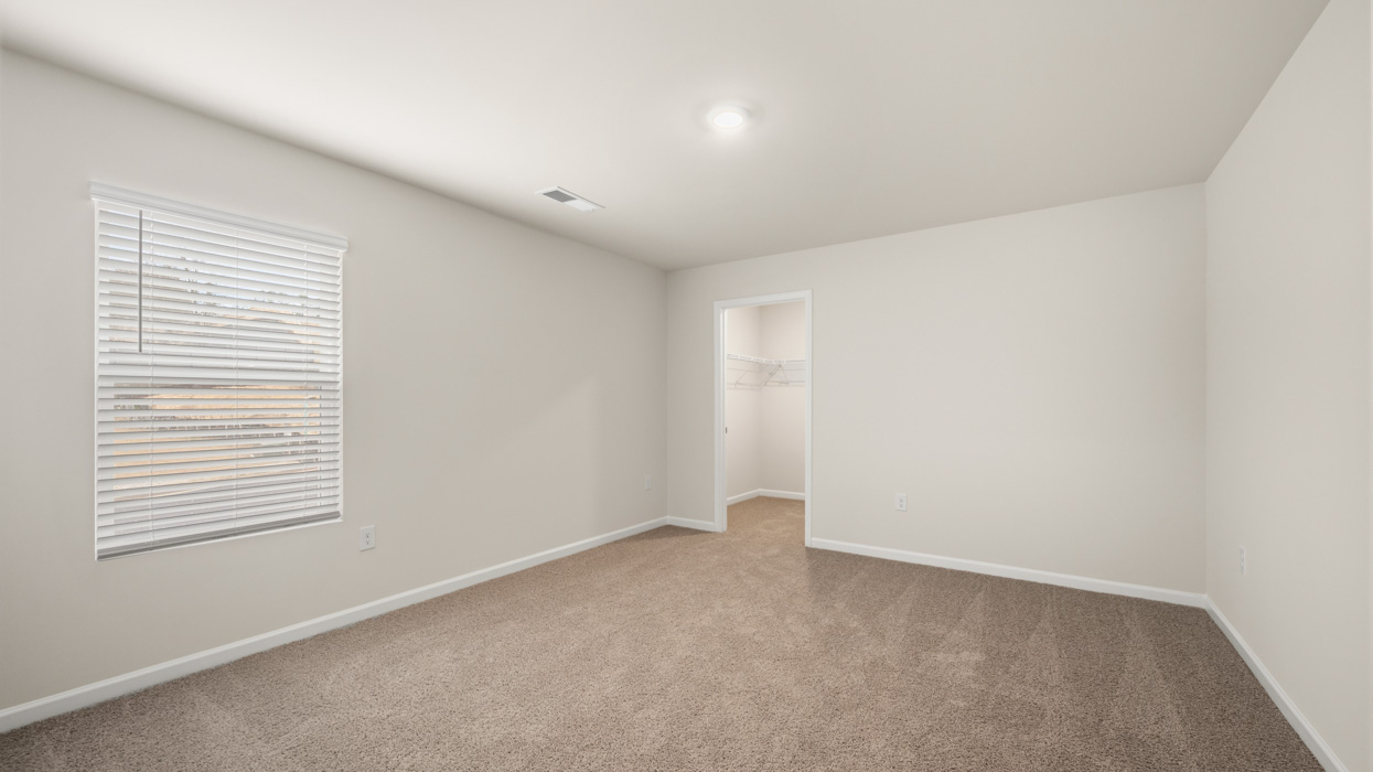 bedroom 2 with natural light and access to bathroom