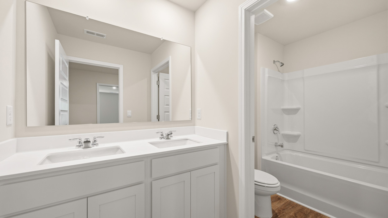bathroom with dual sinks