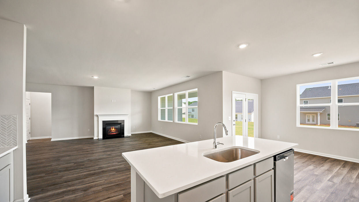 angled kitchen and breakfast room with access to rear patio