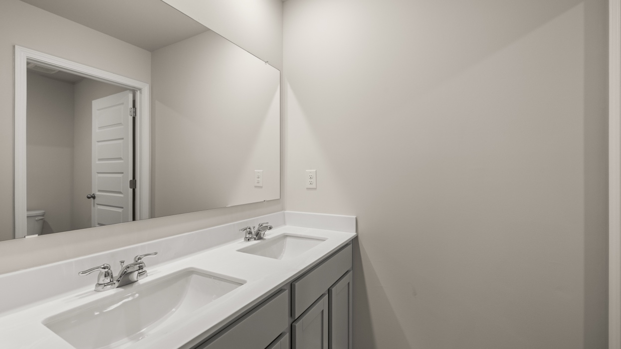 bathroom with dual sinks
